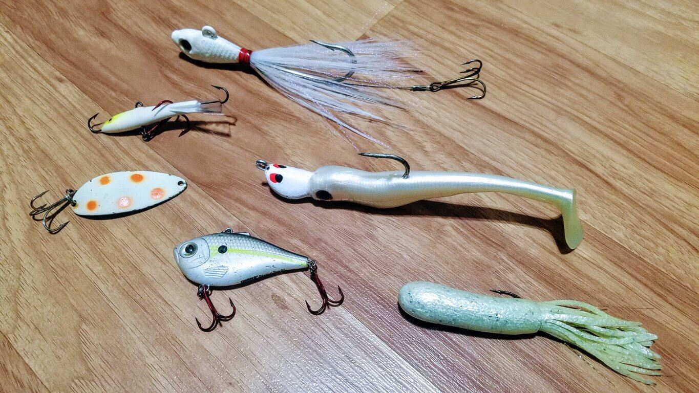 best lures for lake trout on the ice is definetly a 4-6 inch tube